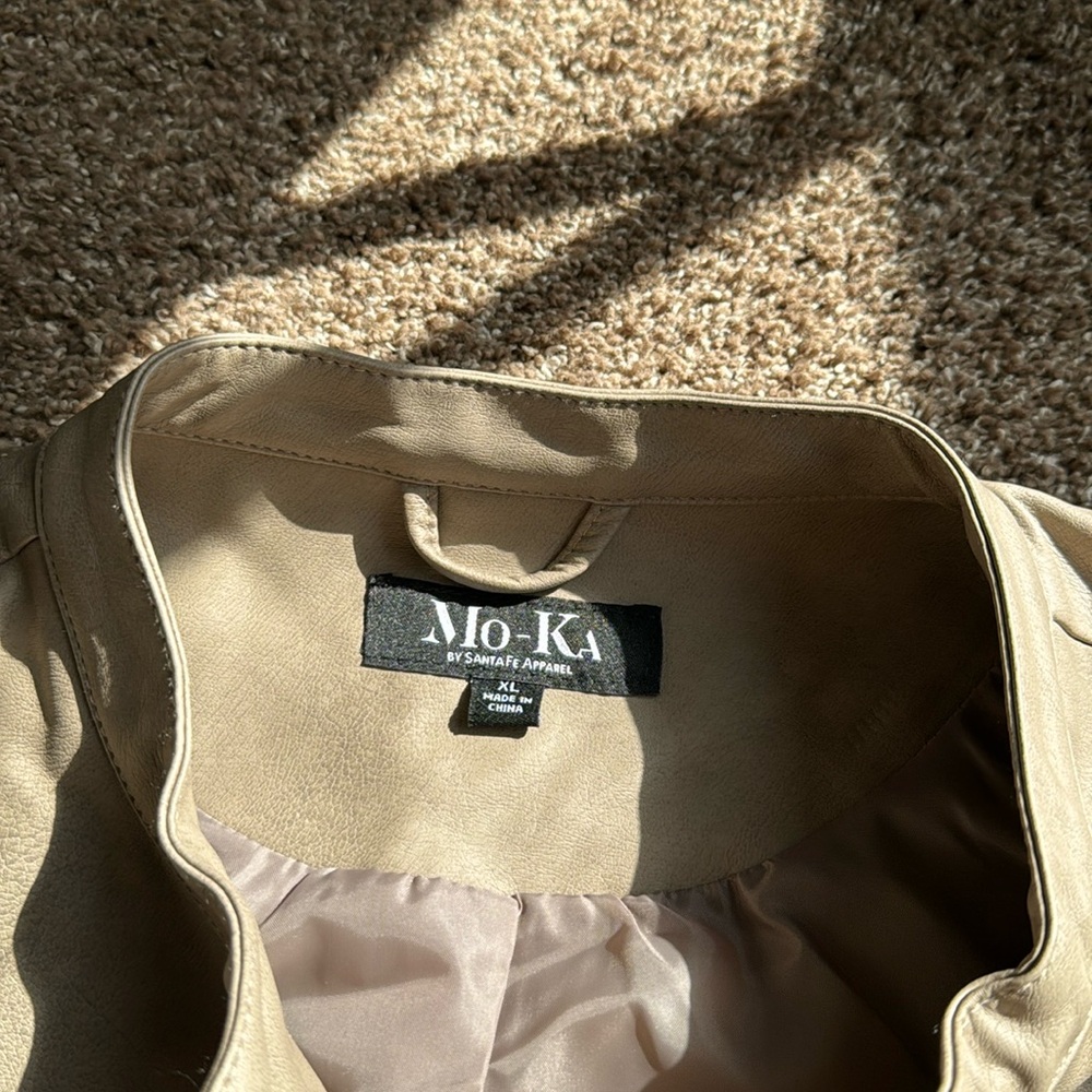 Stylish tan faux leather jacket with zippered pockets